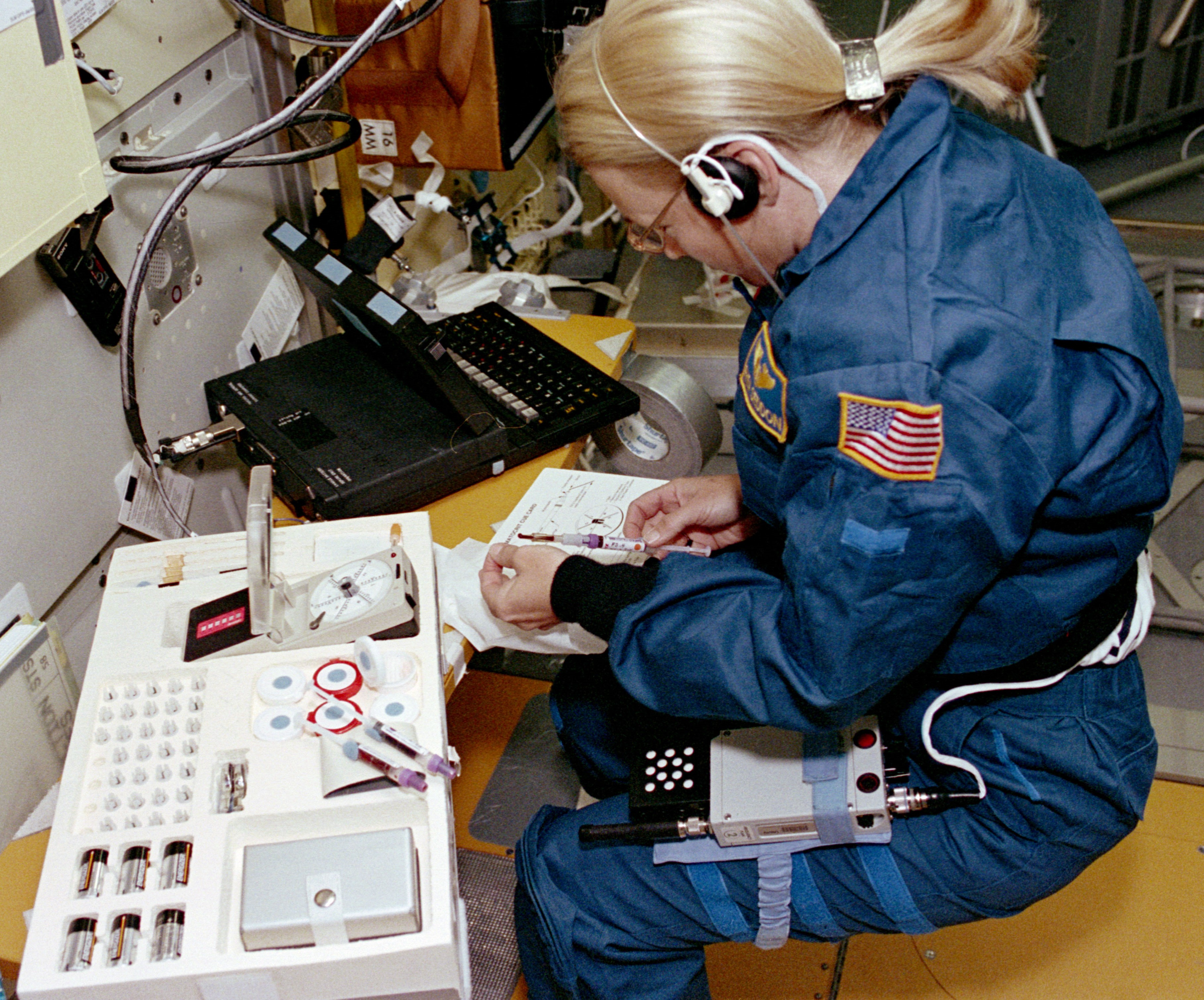 Payload Commander Dr. M. Rhea Seddon processes blood samples