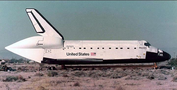 Workers tow Discovery the 36 miles from Palmdale to NASA’s Dryden, now Armstrong, Flight Research Center at Edwards Air Force Base in California’s Mojave Desert.