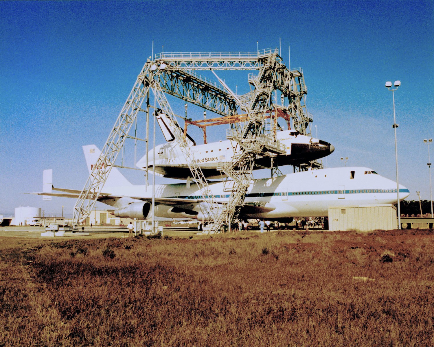 Workers at Vandenberg use Discovery and its SCA to test the Orbiter Lifting Fixture