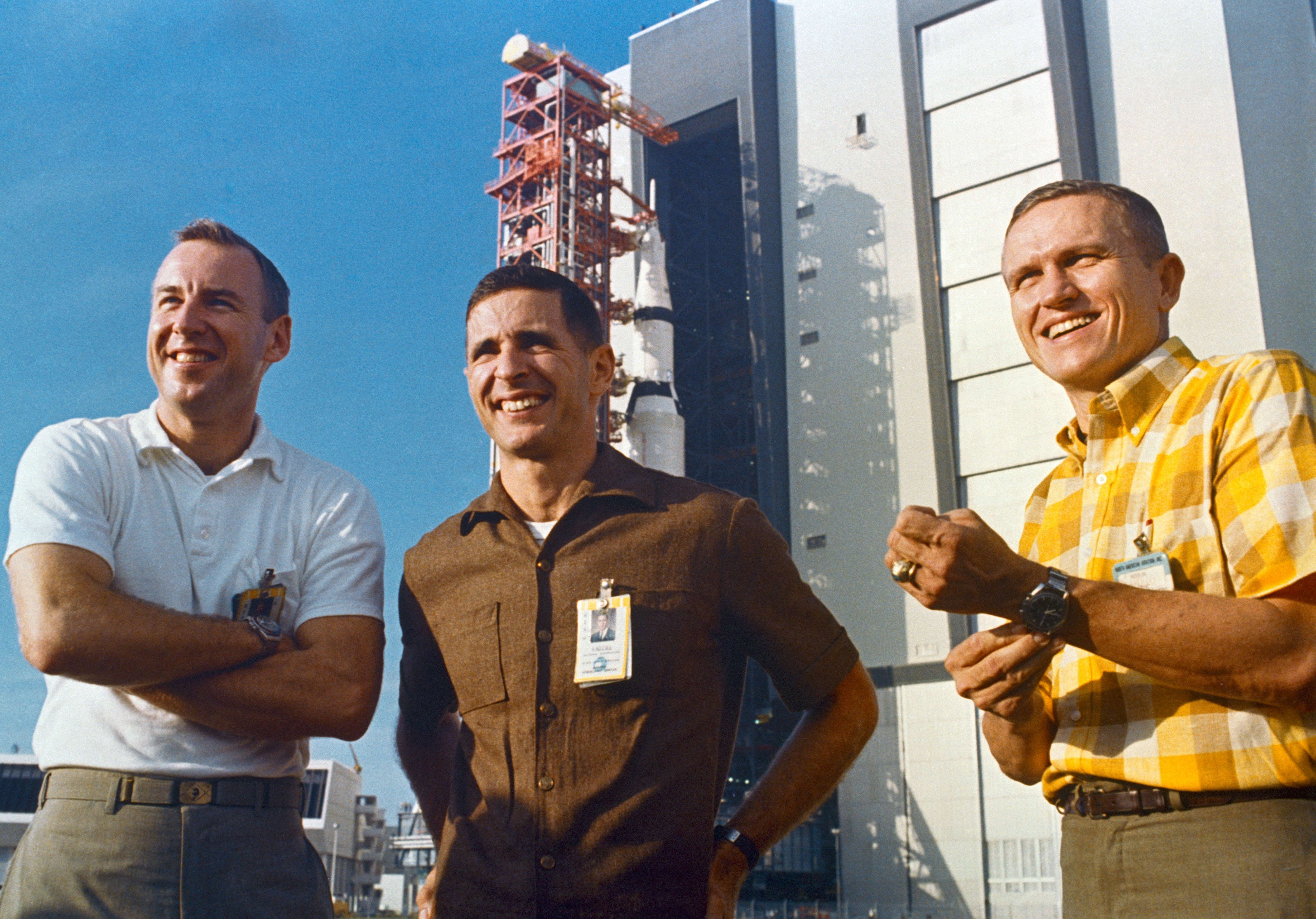 Apollo 8 astronauts James A. Lovell, William A. Anders, and Frank Borman attend the rollout of their Saturn V from the Vehicle Assembly Building to Launch Pad 39A