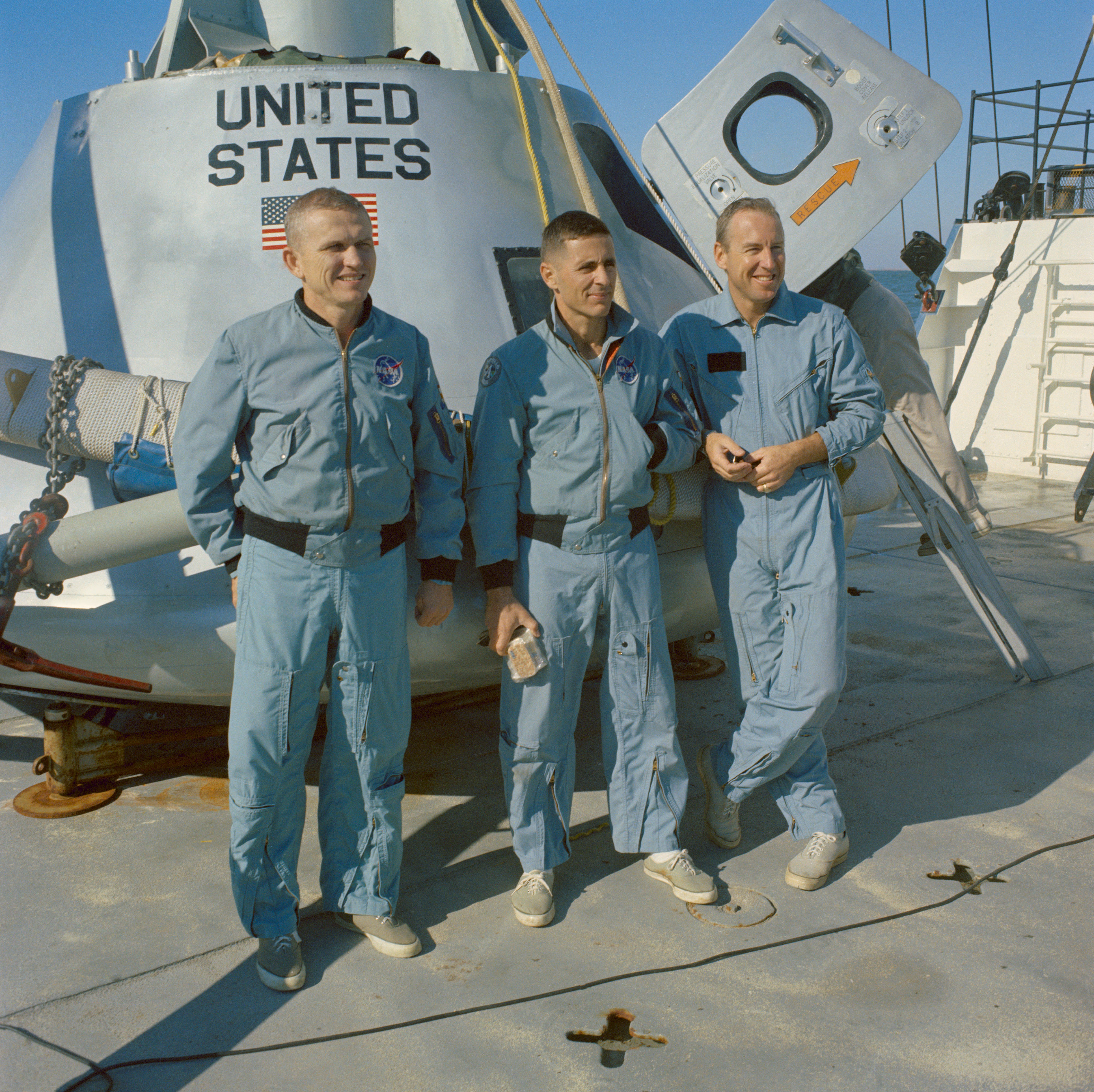 Apollo 8 astronauts Frank Borman, William A. Anders, and James A. Lovell on the deck of the M/V Retriever prepare for their water egress test