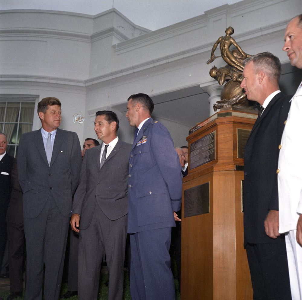 President Kennedy presents the Collier Trophy to X-15 pilots Crossfield, White, Walker, and Forrest S. Petersen of the U.S. Navy