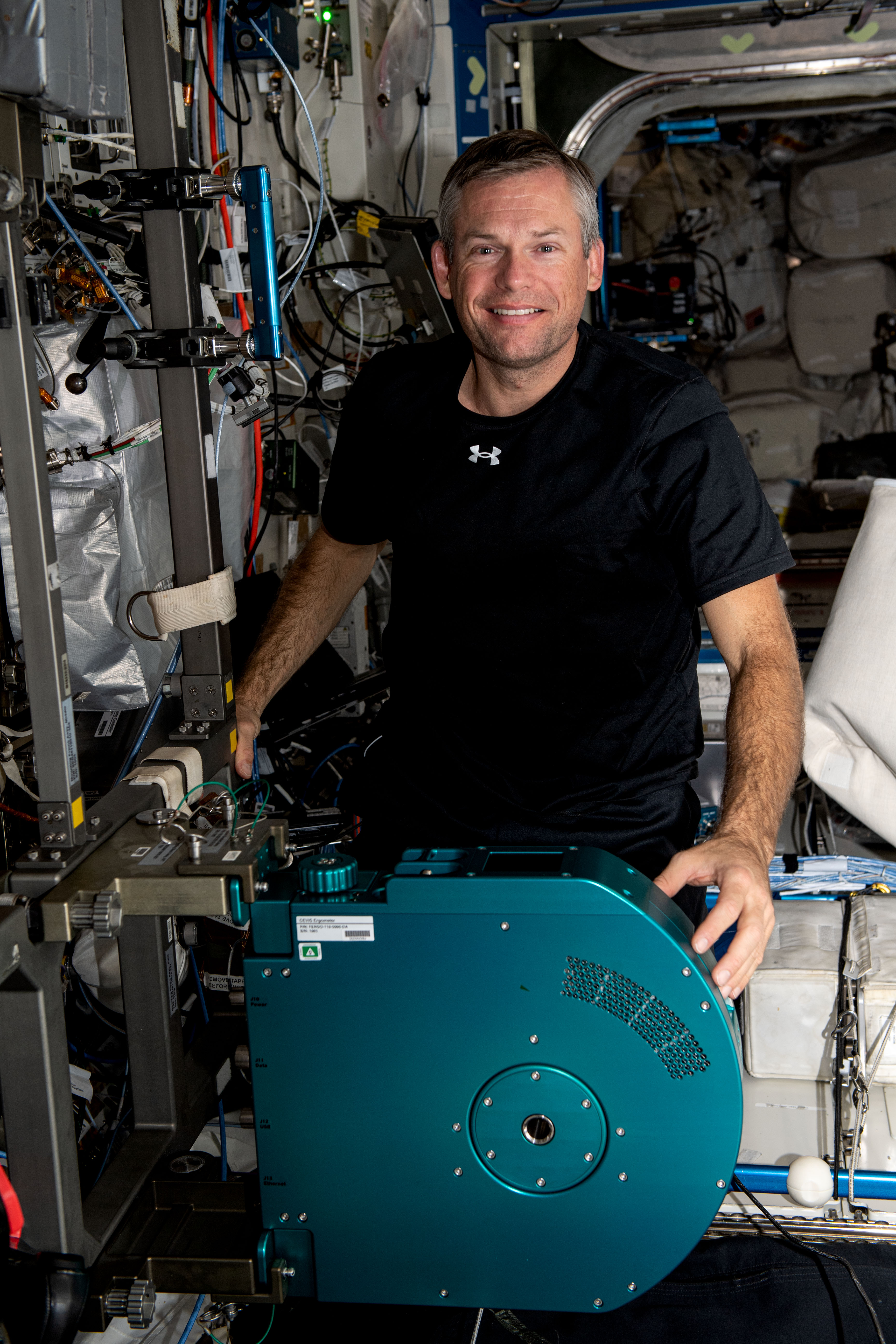 ESA (European Space Agency) astronaut and Expedition 70 Commander Andreas Mogensen is pictured with the International Space Station's new exercise cycle after it was installed in the Destiny laboratory module.