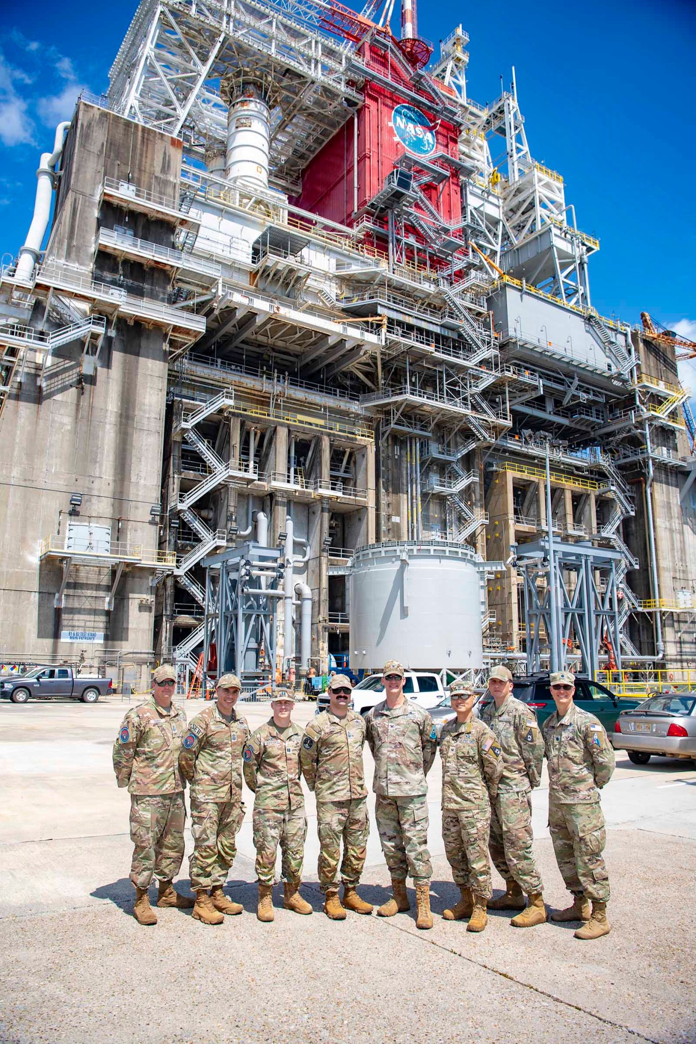 The United States Space Force Training Leadership Team stops for a photo in front of test stand at NASA Stennis