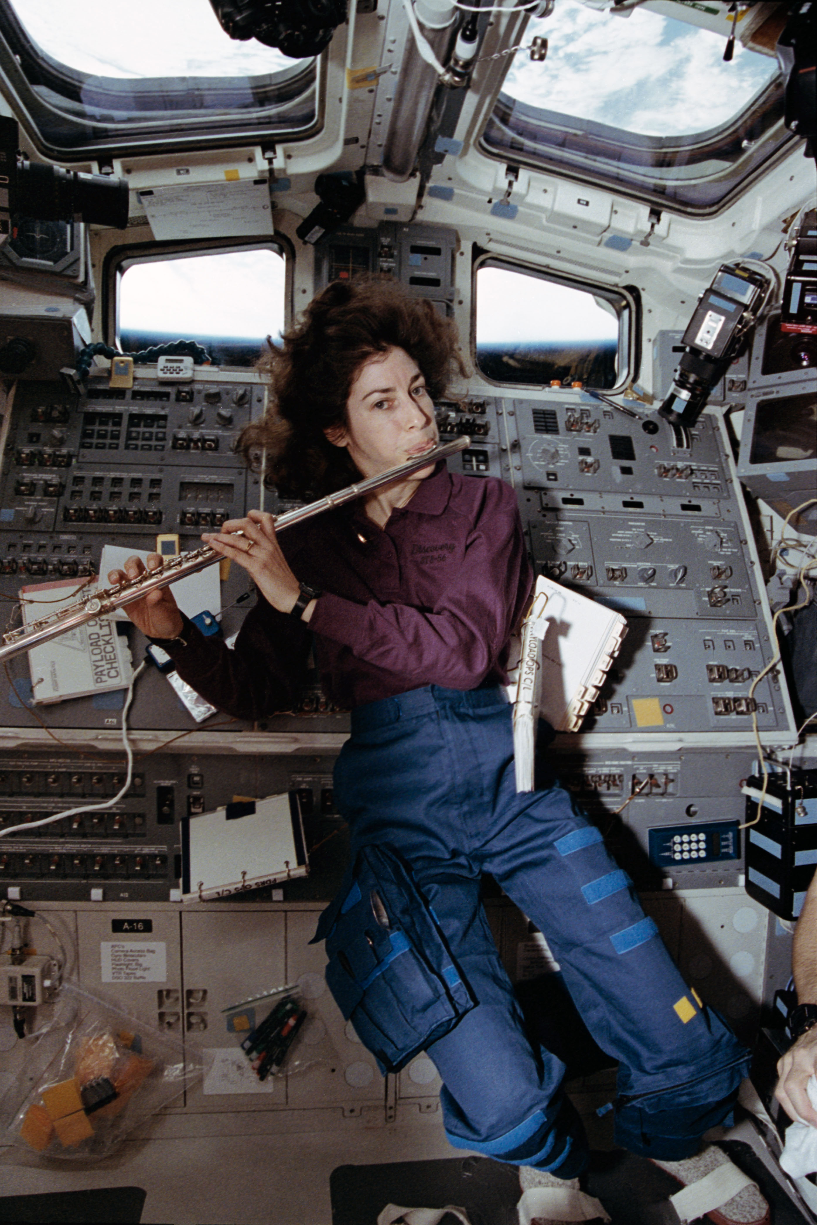 Ochoa plays the flute on Discovery’s flight deck