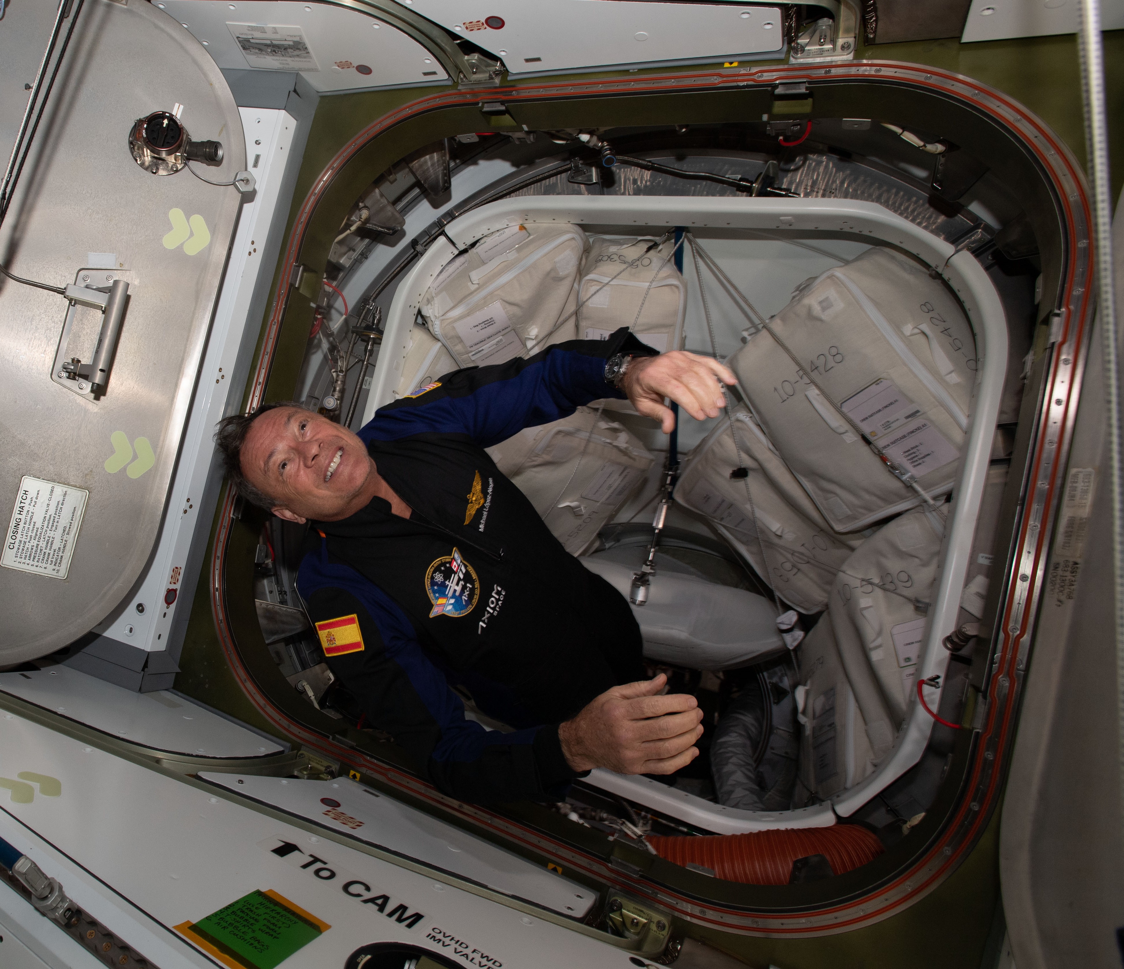 Axiom astronaut Michael E. Lopez-Alegria floats into the space station during the Ax-1 mission