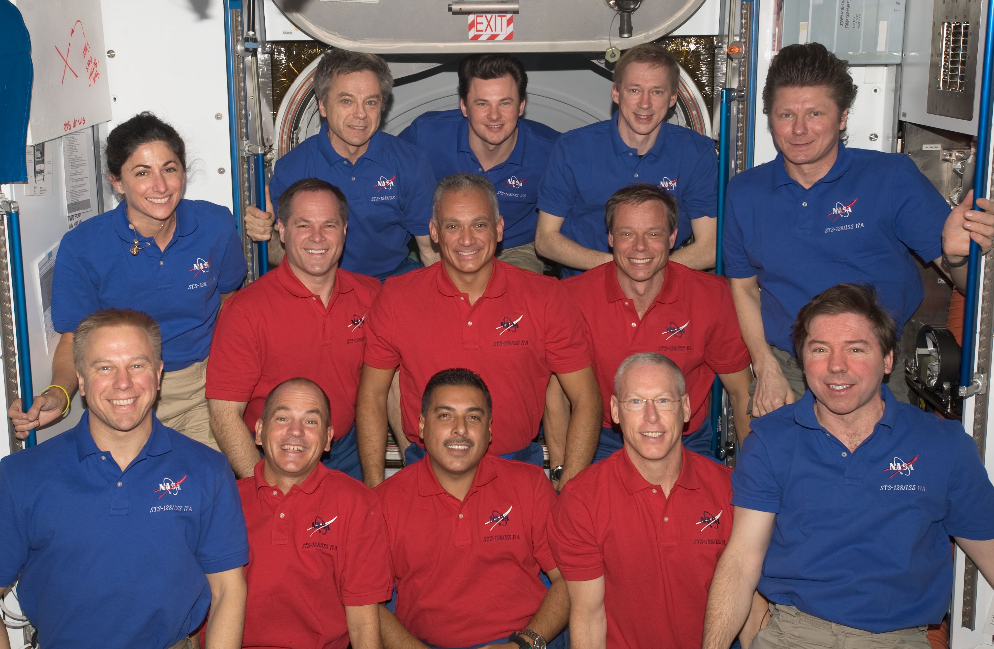 NASA astronaut John D. “Danny” Olivas, at center, with the STS-128 and Expedition 20 crews