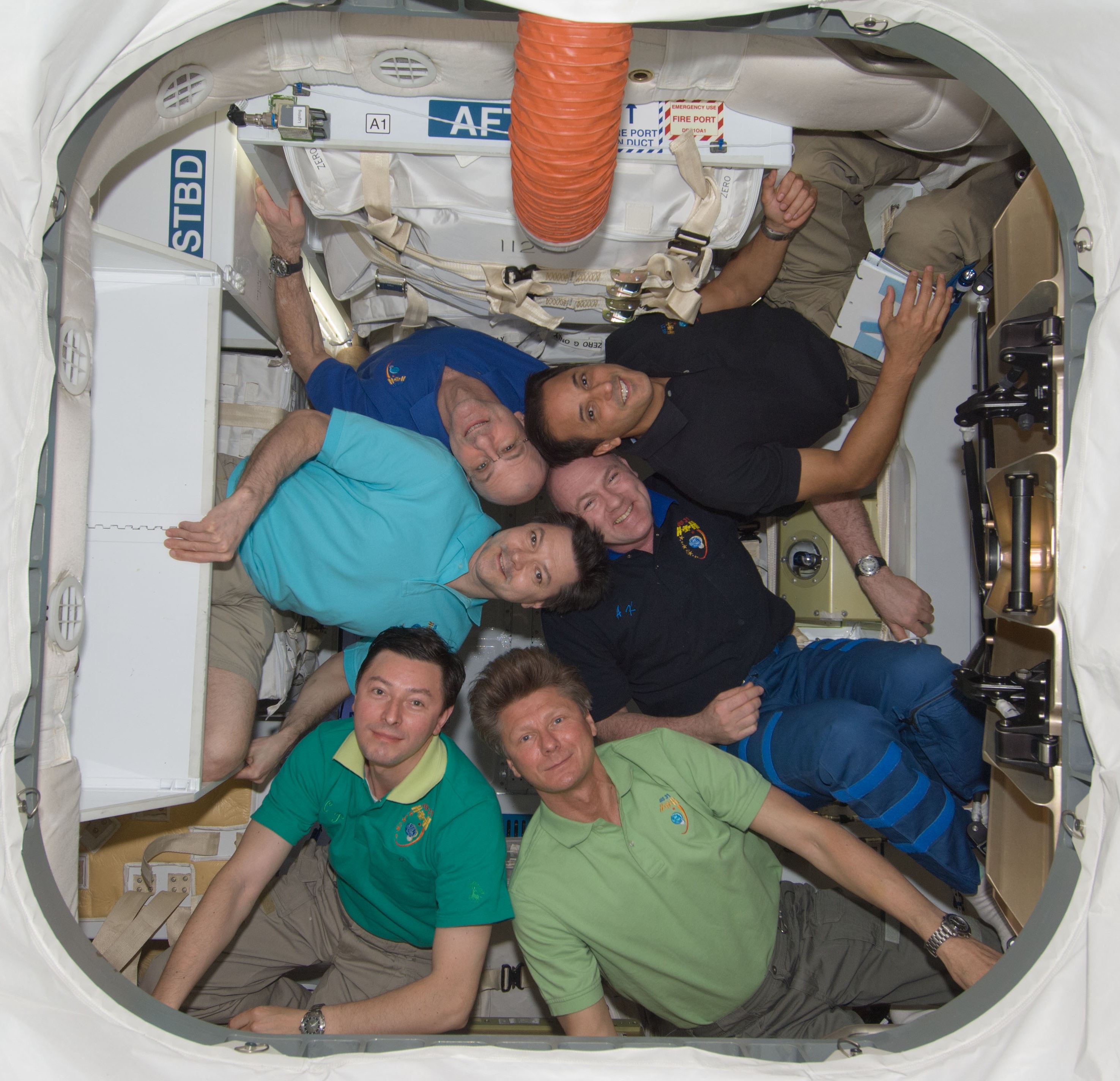 NASA astronaut Joseph M. Acaba with his Expedition 31 crewmates inside the SpaceX Dragon resupply vehicle