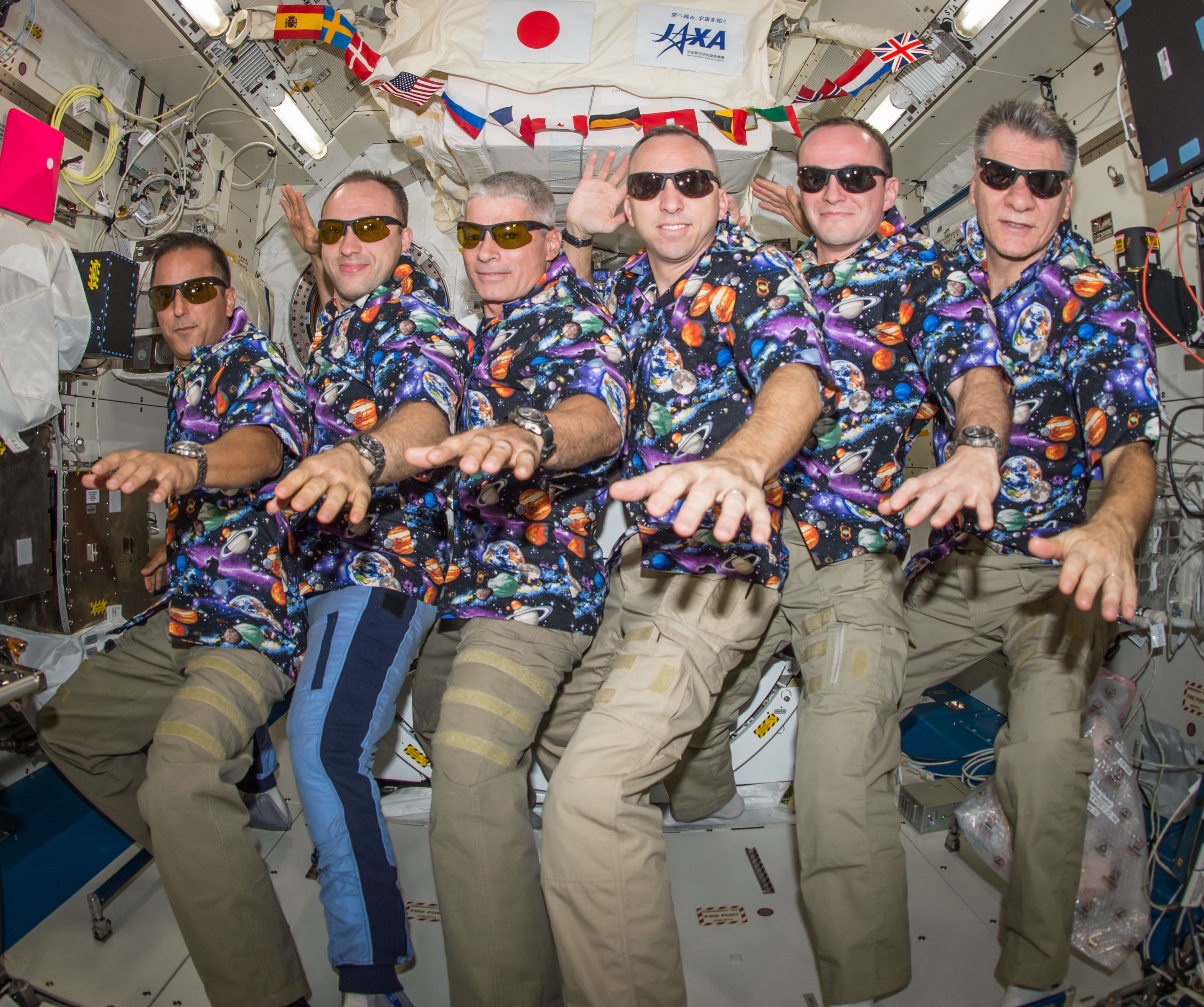 Acaba with his Expedition 53 crewmates.