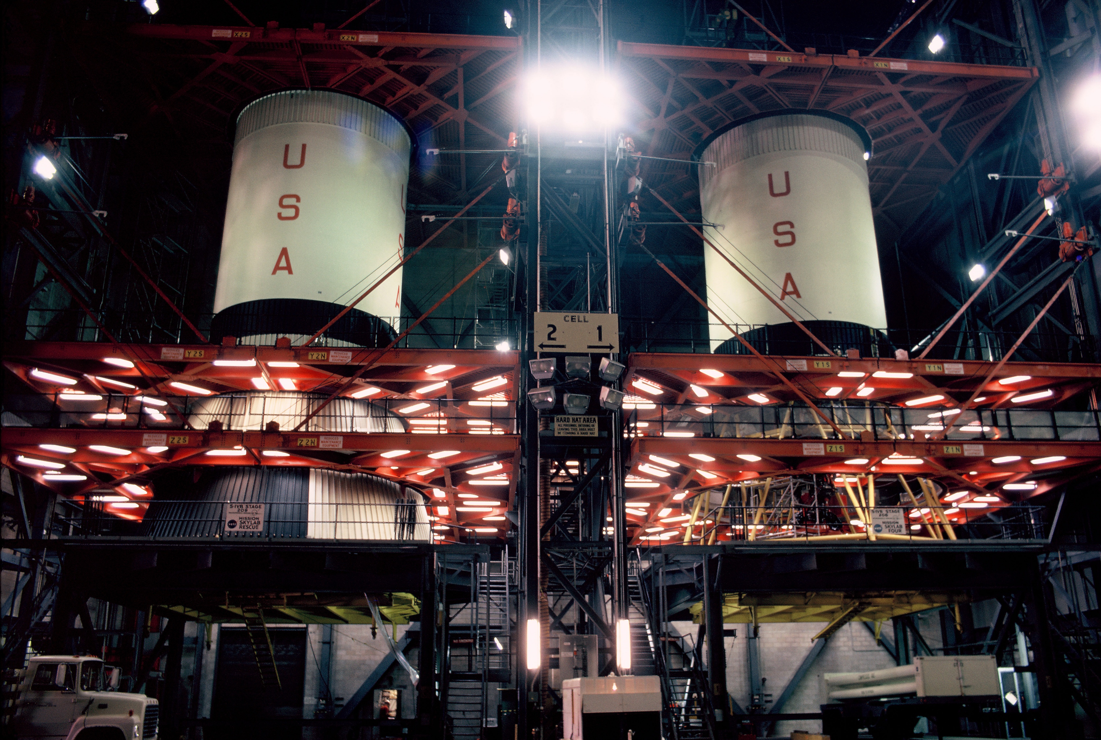 The two S-IVB second stages for the Skylab 4 SA-208 rocket, right, and the SA-209 Skylab rescue rocket sit side by side in the VAB