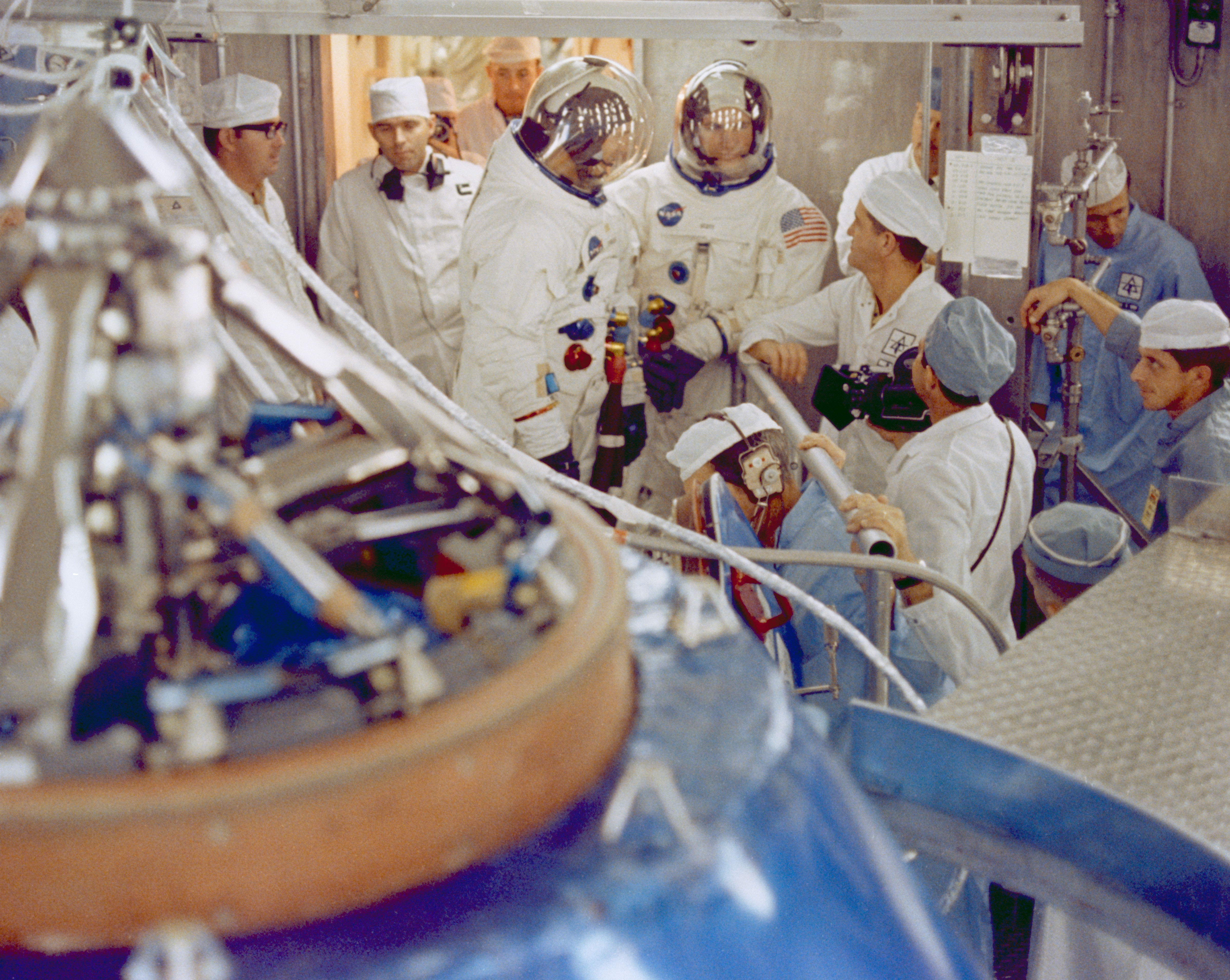 Photo of The Apollo 9 prime crew of James A. McDivitt, left, David R. Scott, and Russell L. Schweickart, not pictured, prepares for an altitude chamber test of their Command Module (CM) in the Manned Spacecraft Operations Building at NASA’s Kennedy Space Center in Florida