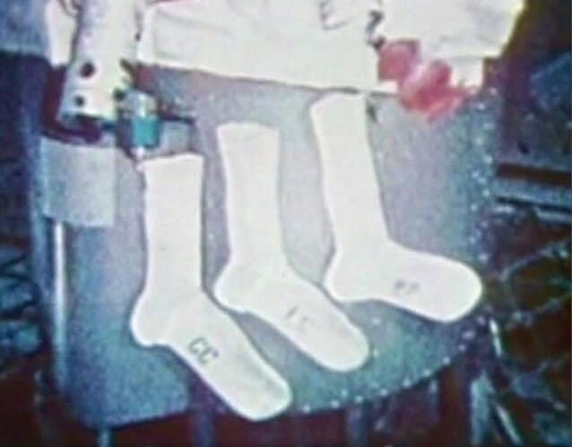 Carr, left, Gibson, and Pogue’s Christmas stockings