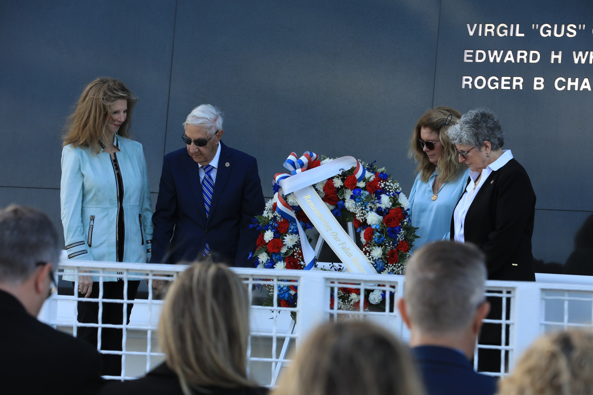 Family members of fallen astronauts Kathie Scobee Fulgham, Lowell Grissom, Sheryl Chaffee, and Karen Bassett Stevenson place a wreath at the Space Mirror Memorial at NASA’s Kennedy Space Center Visitor Complex in Florida on Thursday, Jan. 25, 2024, during the agency’s Day of Remembrance.