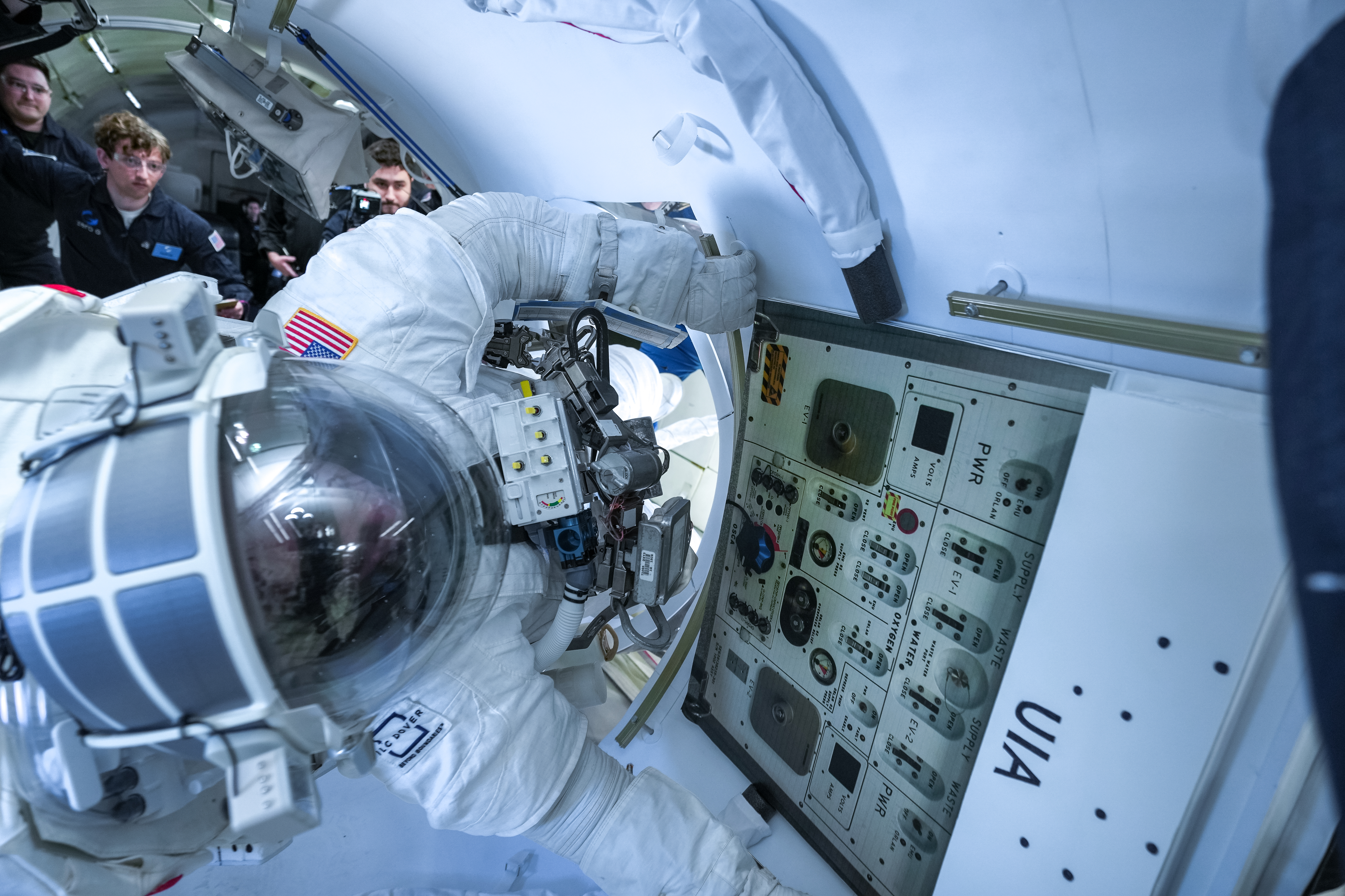 Collins Aerospace’s chief test astronaut John “Danny” Olivas demonstrates a series of tasks during testing of Collins’ next-generation spacesuit while aboard a zero-gravity aircraft.