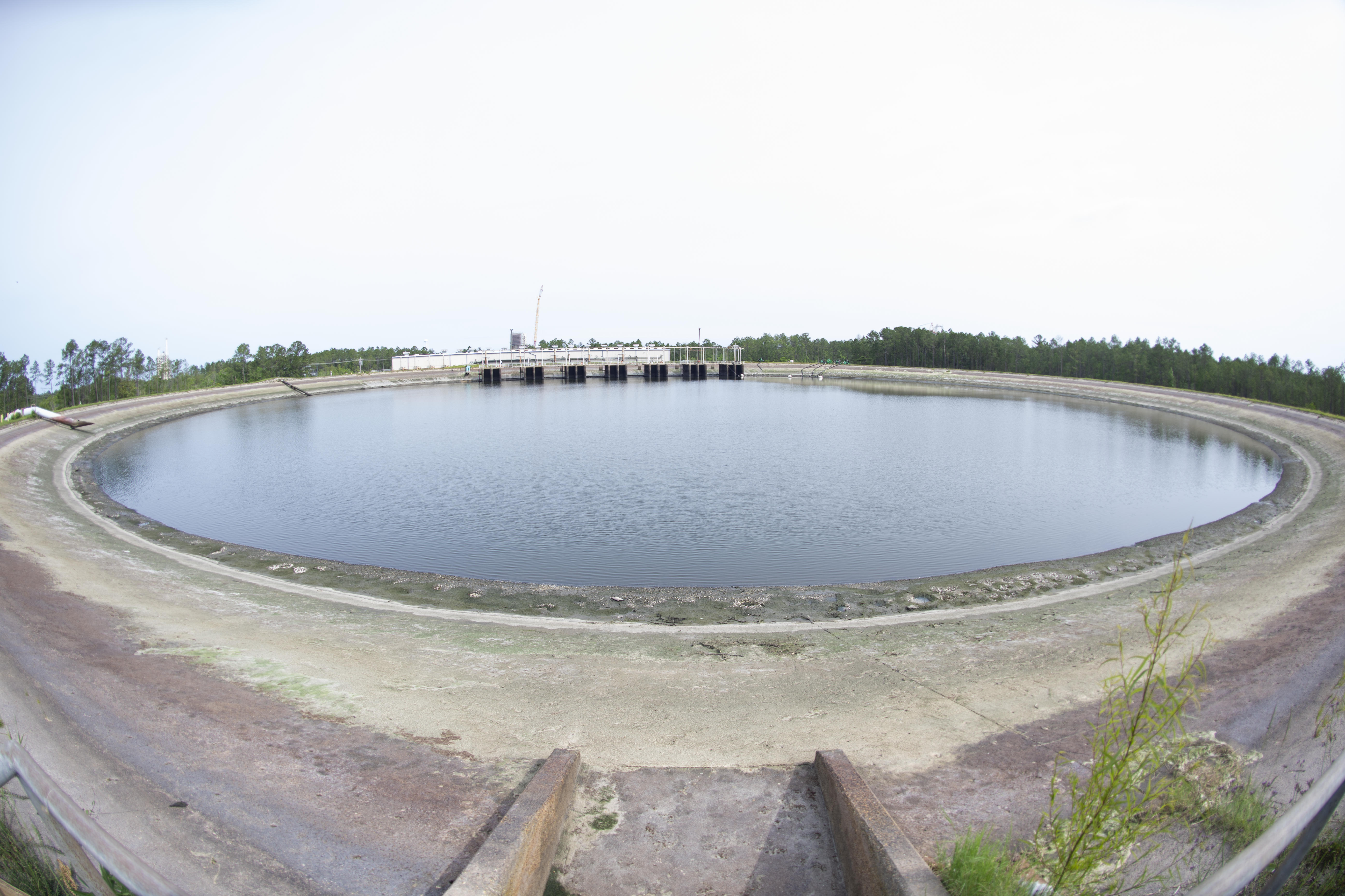 The reservoir at Stennis Space Center on May 11 shown at a dramatically lowered level, exposing large areas of the reservoir floor after 40 million gallons were pumped out.