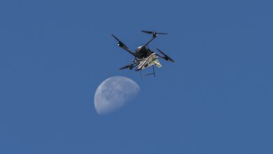 An atmospheric probe model carried by a quad rotor aircraft rises and the Moon is visible.